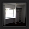 Desk between robes.