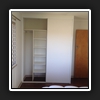 Left side of robe has long hanging and a shelf tower unit with adjustable shelves.