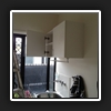 Cabinet installed with hanging rod underneath.
