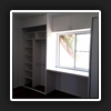 Internals installed with hinged cabinet above window and between robes.