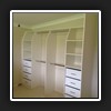 At the lowest point and due to bulkhead requirements, we splay the dividers so you can at least use the top shelf.