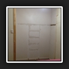 Existing shelving removed, new jambs and architraves installed.
