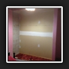Existing hinged doors and shelving removed. Bulkhead raised and width of robe widened.