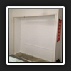 Old hinged doors and shelving removed.